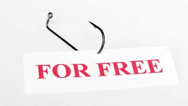 Ein Fischerhaken der durch ein Schild mit den Worten For Free sticht